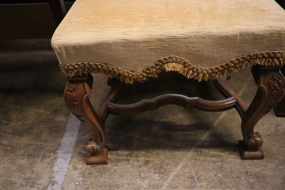 A 19th century Flemish style carved walnut armchair, upholstered in brocade and a Georgian style caned walnut dining chair